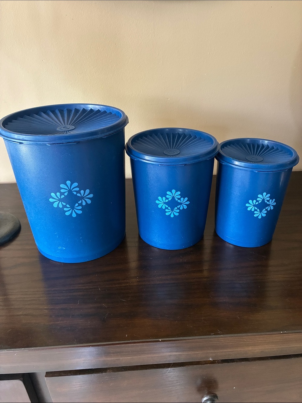 Tupperware Blue Three-Piece Storage Canister Set with Floral Medallions